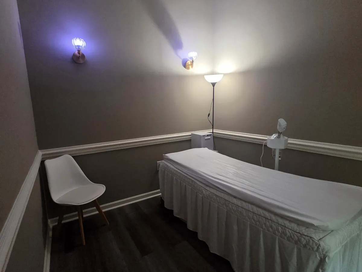 Private treatment room at Miso Beauty Skincare with a treatment bed, chair and soft lighting